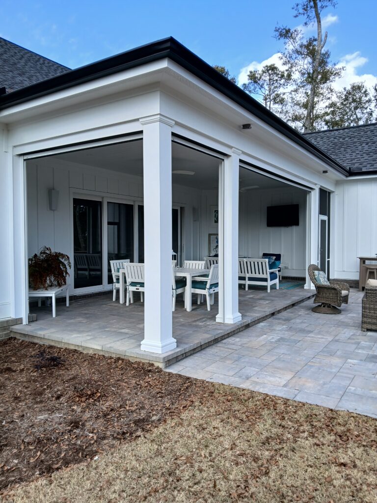 Outdoor patio with white furniture and a covered area, showcasing a stylish space for relaxation, relevant to window treatment options.